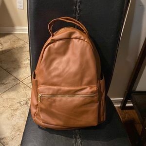 Medium size leather, brown, backpack, blue white striped interior